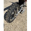 Rear X30 Bridgestone tire mounted on dirt bike 