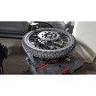 Changing a motorcycle tire with portable tire changing stand 